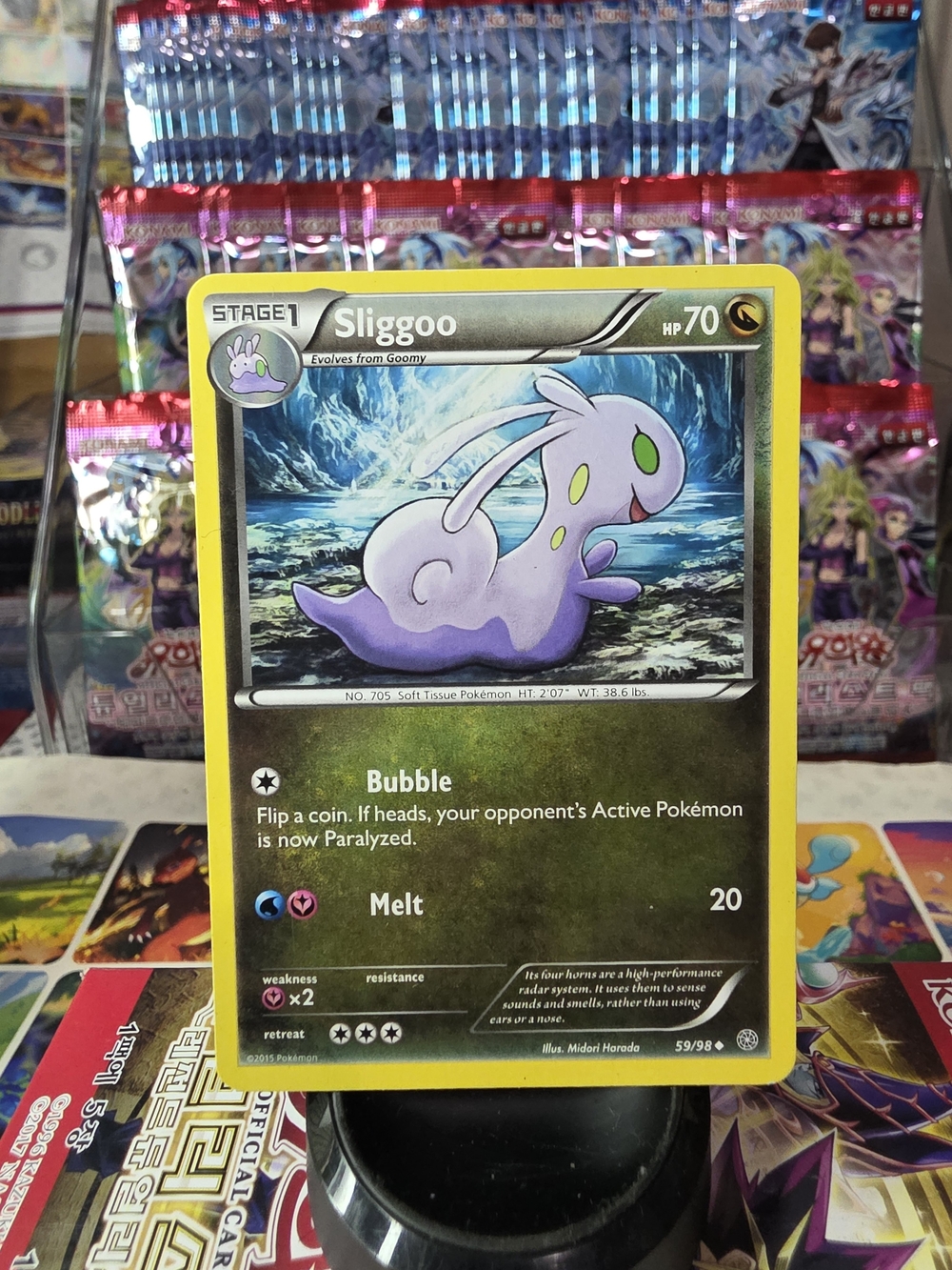 Pokemon Sliggoo Card Yellow Border with Purple Character and Green Accents